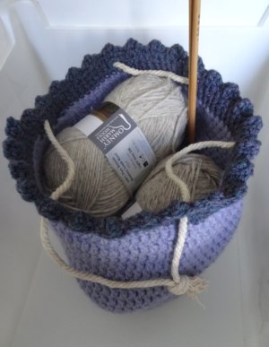 A hand made Crocheted draw string project bag